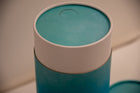 A closeup of scatter tube with a blue cascade design