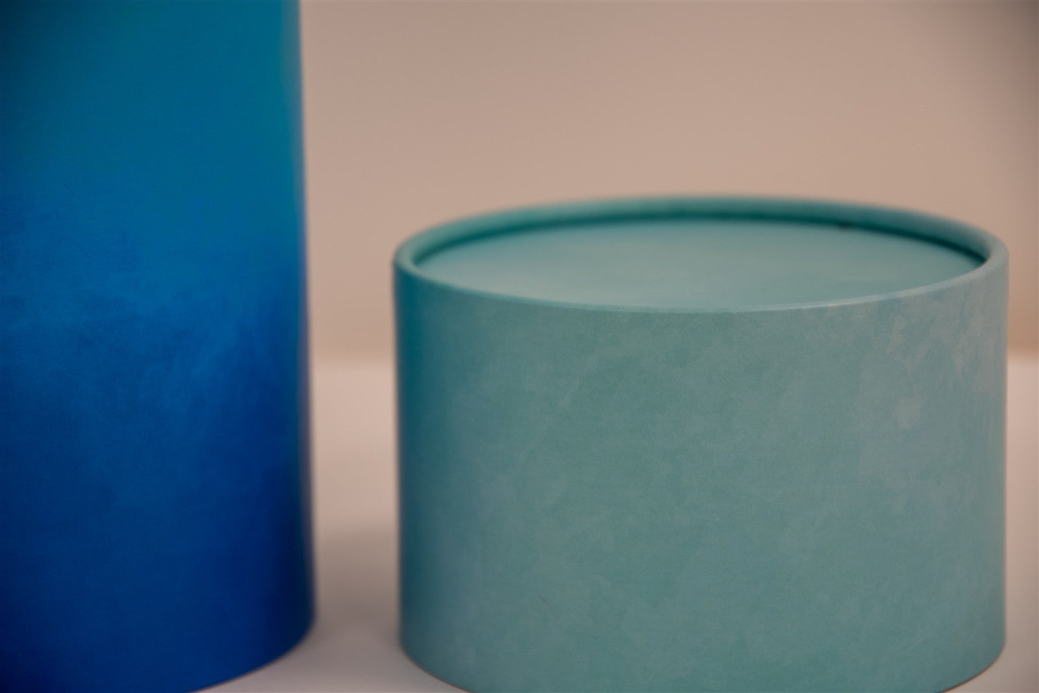 A closeup of scatter tube with a blue cascade design