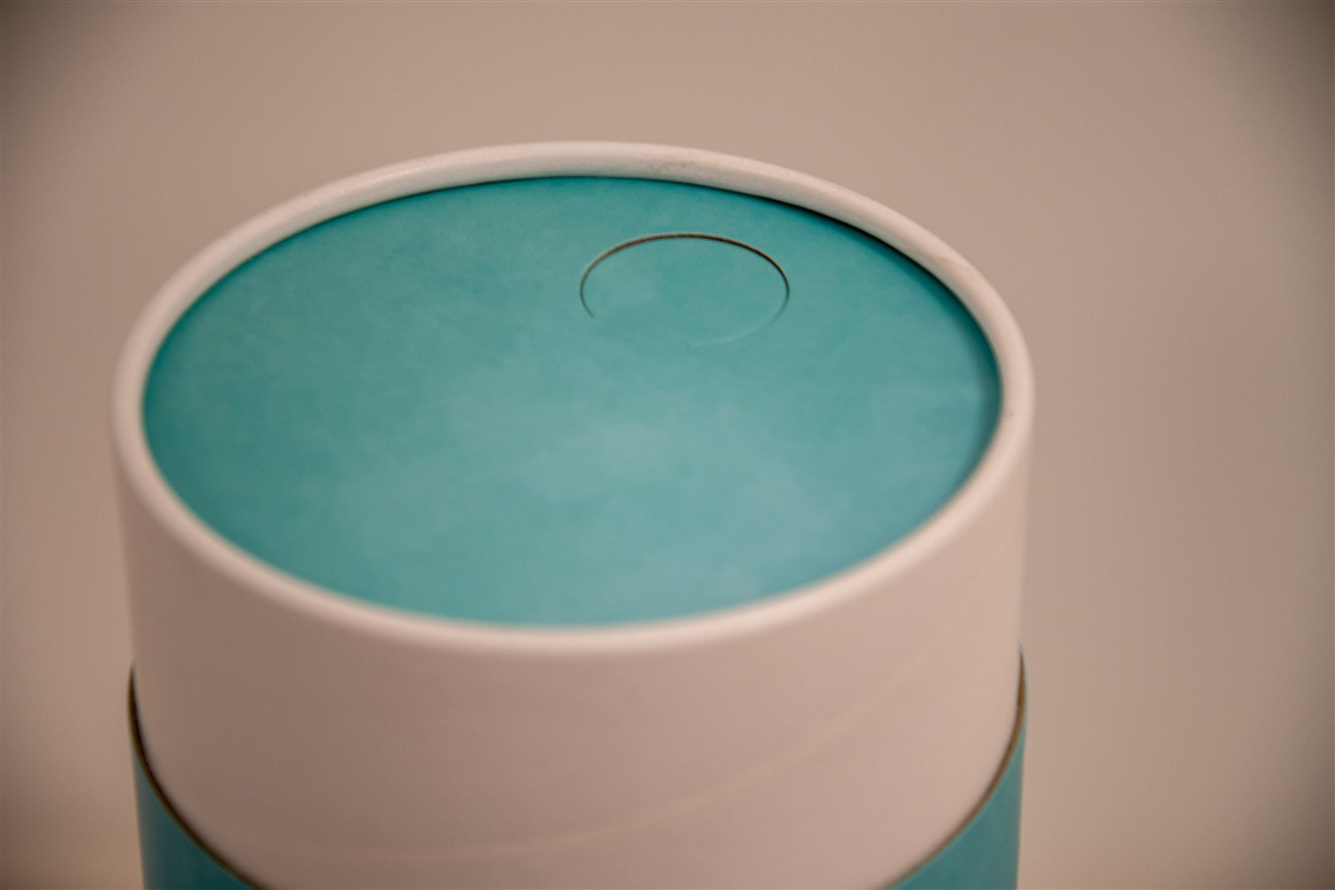 A closeup of scatter tube with a blue cascade design