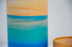 A closeup of scatter tube with a golden tides design