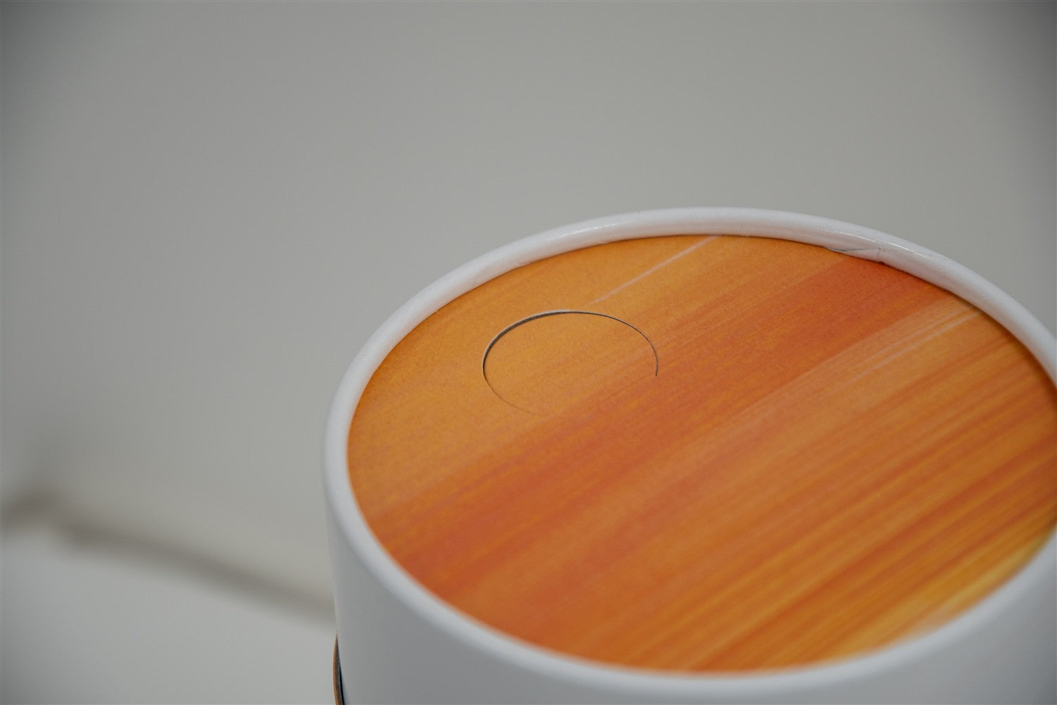 A closeup of scatter tube with a golden tides design