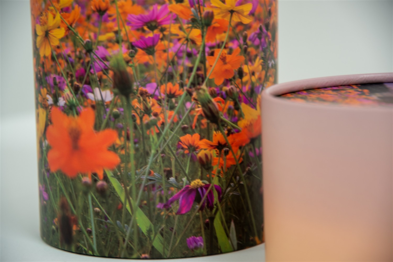 A closeup of scatter tube with a meadow design