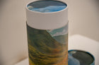 A closeup of scatter tube with a mountains design