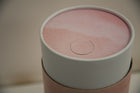 A closeup of scatter tube with a pink skies design