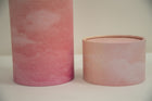 A closeup of scatter tube with a pink skies design