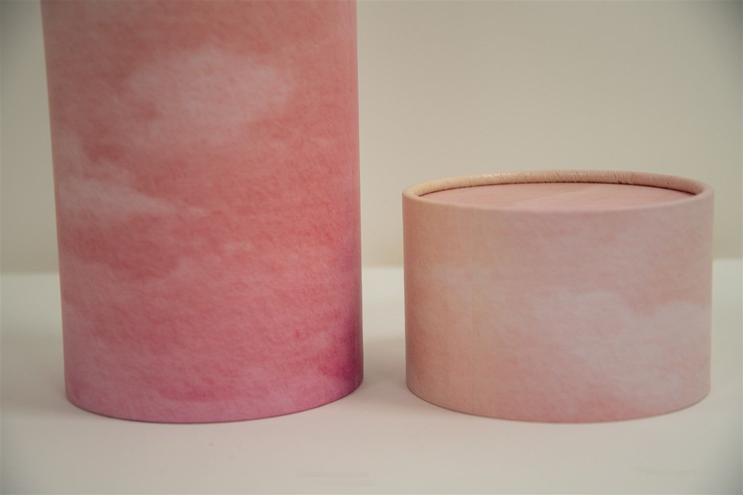 A closeup of scatter tube with a pink skies design