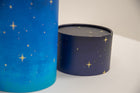 A closeup of scatter tube with a starry night painting design