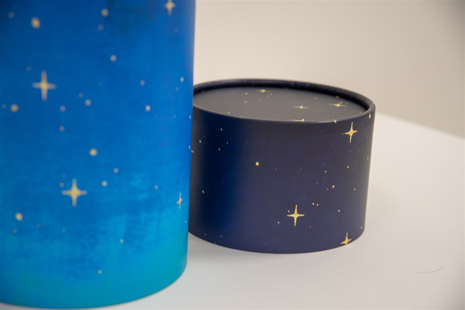 A closeup of scatter tube with a starry night painting design