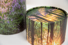A closeup of a scatter tube with a woodland design