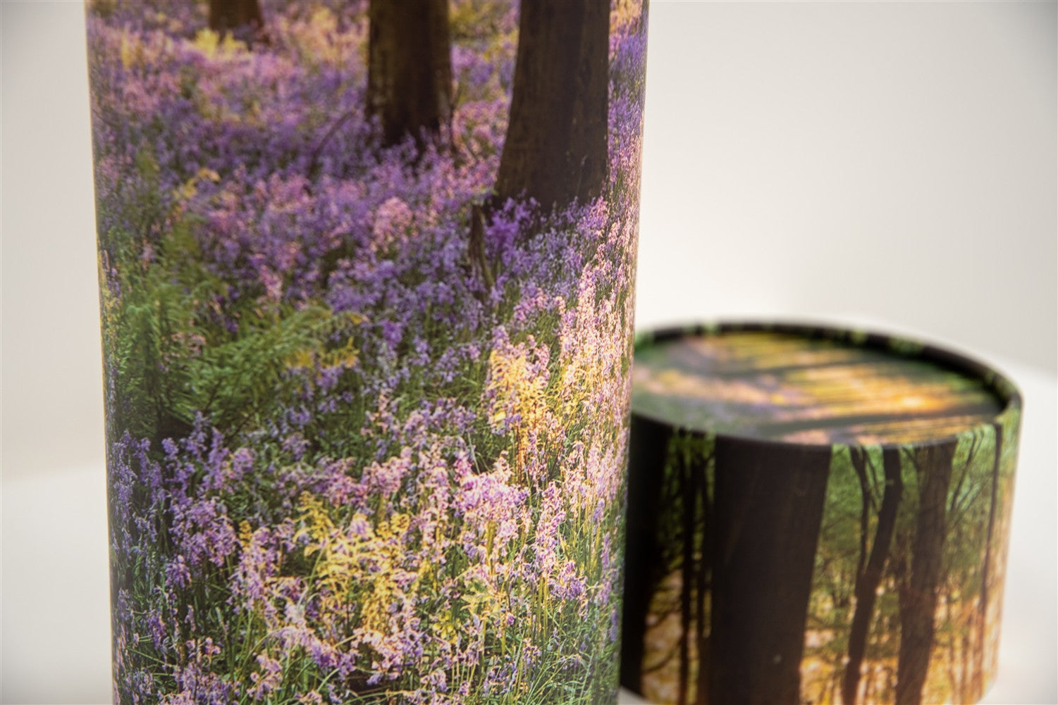A closeup of a scatter tube with a woodland design