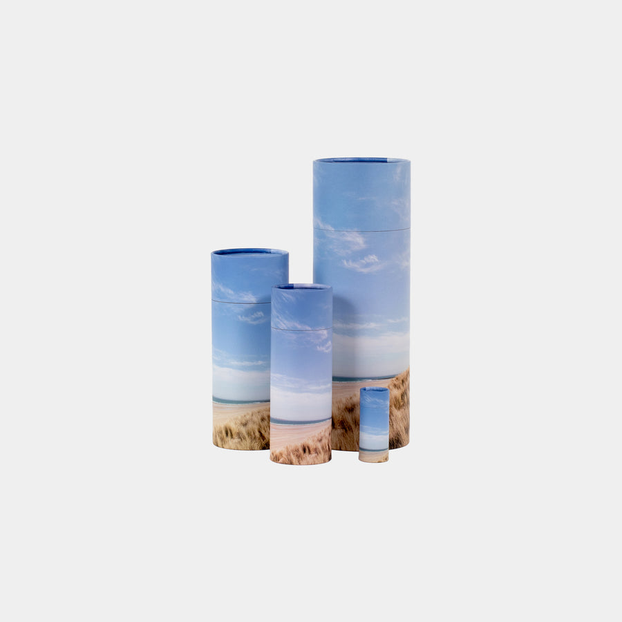 A group of beach design scatter tubes showing, keepsake, small, medium and large sizes 