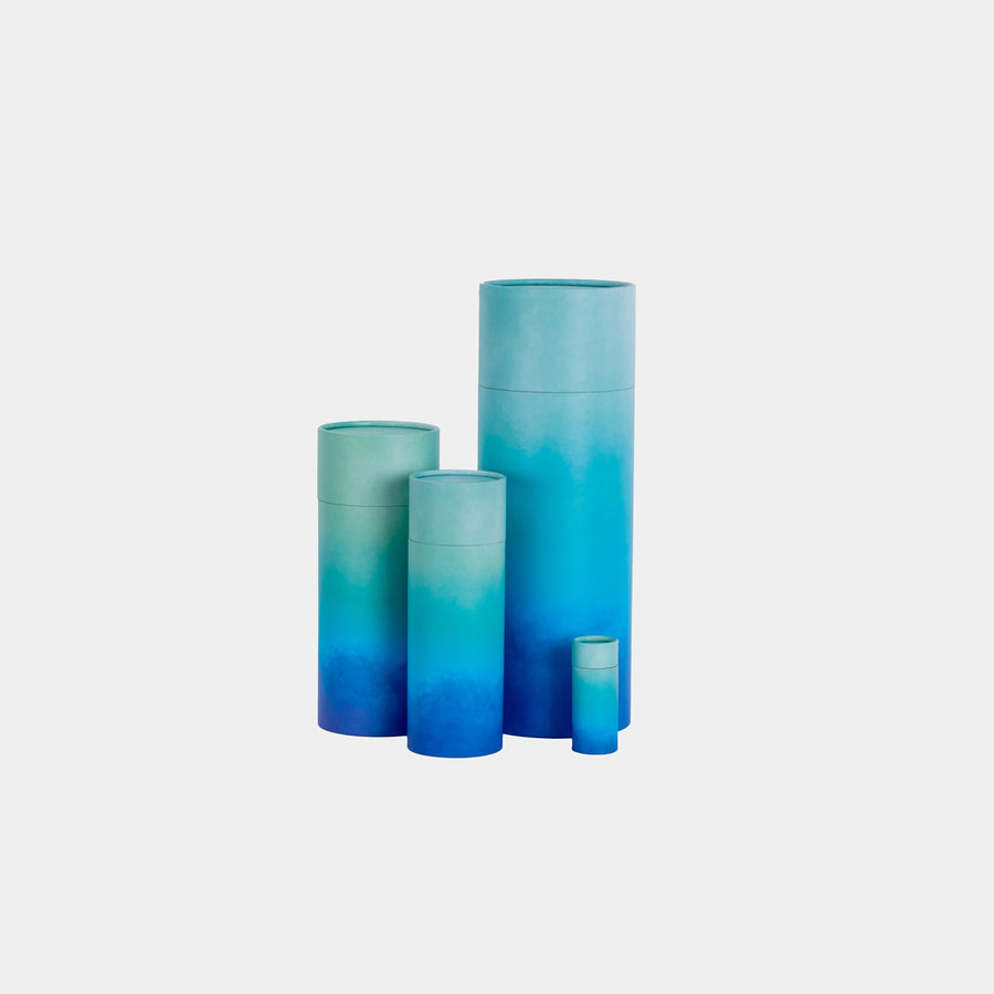 A group of blue cascade design scatter tubes showing, keepsake, small, medium and large sizes 