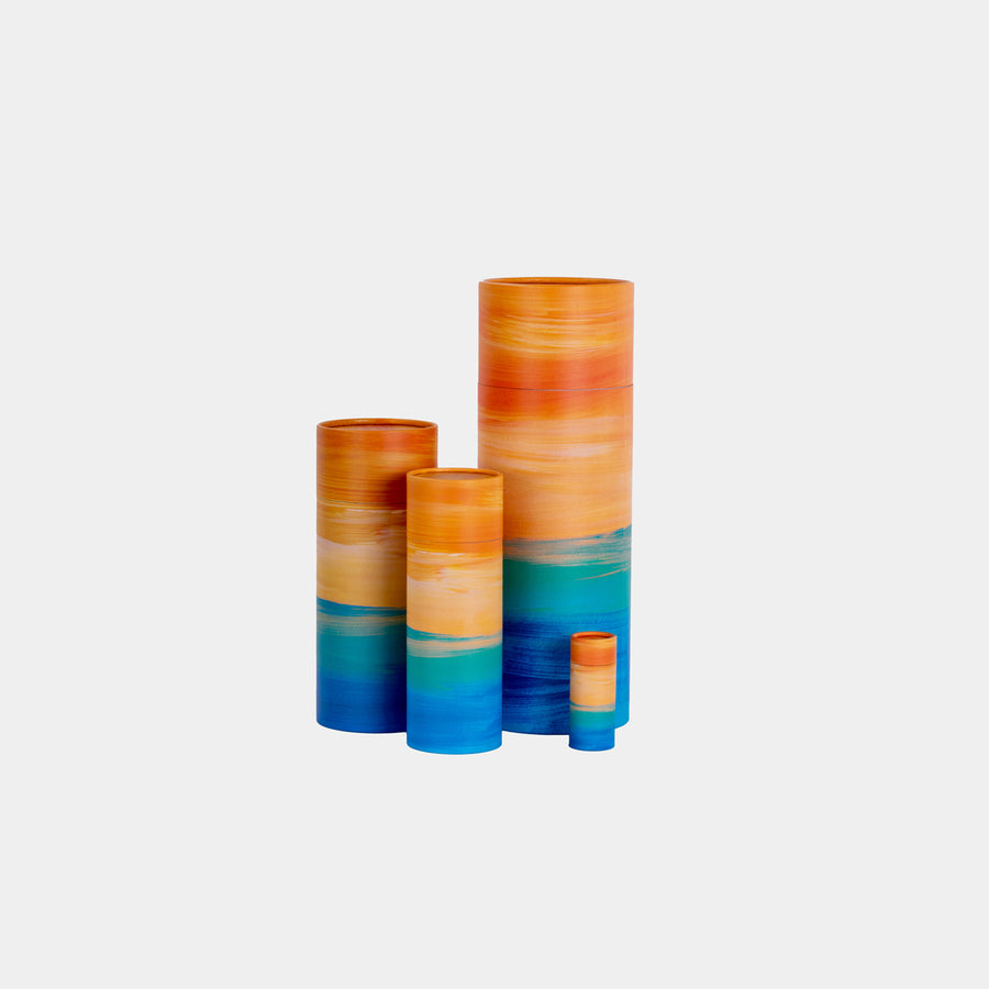 A group of golden tide design scatter tubes showing, keepsake, small, medium and large sizes 