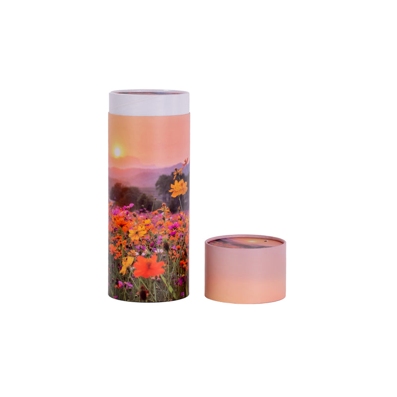 A scatter tube with a meadow painting design showing lid removed