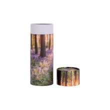 A scatter tube with a woodland design showing lid removed